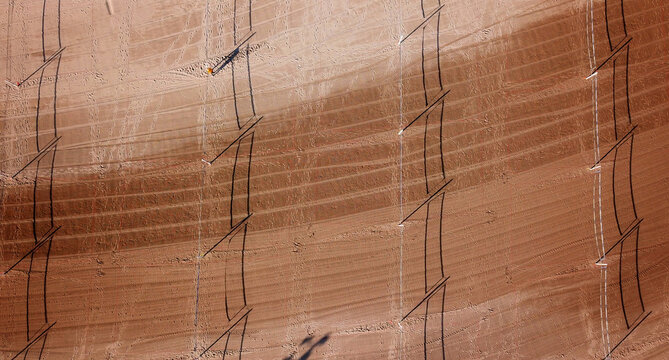 Aerial view of sand dunes with geometric patterns etched by wind and human intervention, Chicago, Illinois, United States.