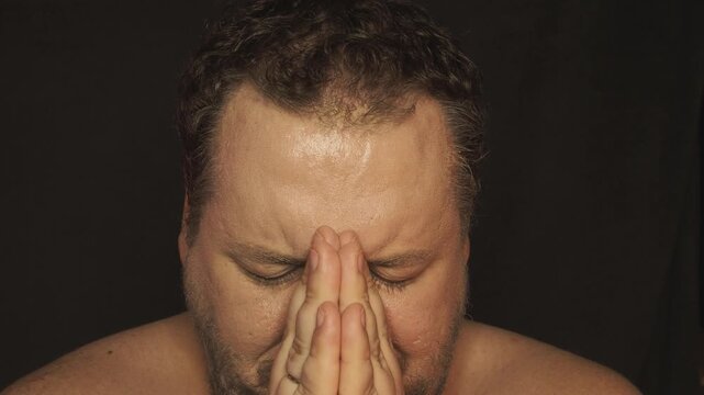 A grown man cries, prays and hopes for a miracle.