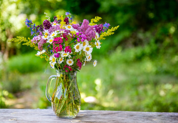Beautiful bouquet with summer wild flowers and margaritas 