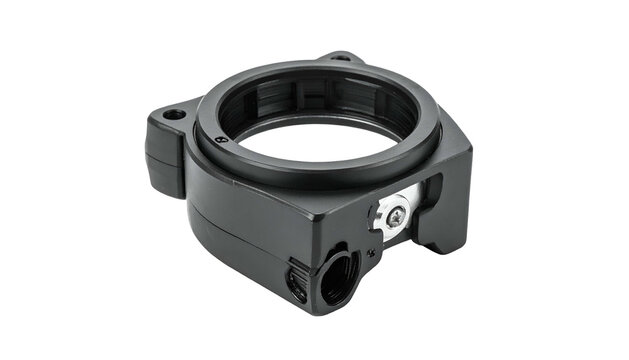 A black, machined metal circular component with integrated mounting features and a dark background