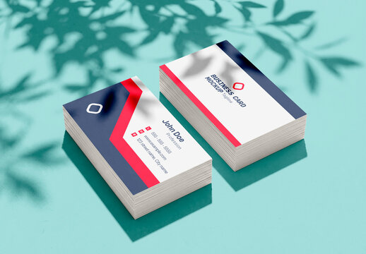 Stack of blank business cards with plant shadow