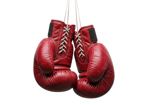ultra-realistic medium close-up of old, heavily scuffed crimson red leather boxing gloves hanging by frayed laces on a transparent high-key studio background. concept of vintage sports history