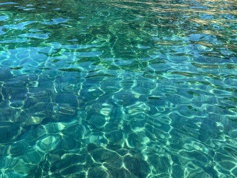 Sea emerald crystal clear water surface.