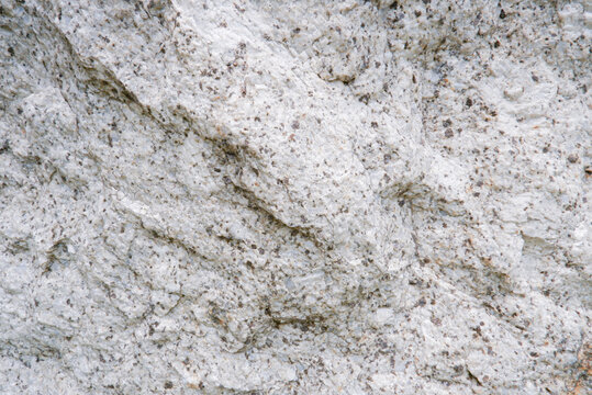 Close up of weathered granite surface texture. Intrusive igneous rock