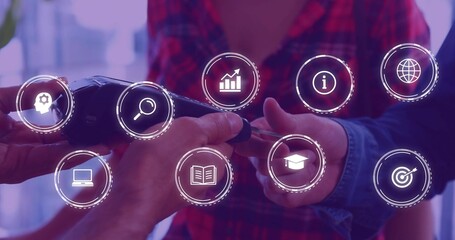 Passing cordless drill between colleagues' hands at shared workspace, with digital icons overlay