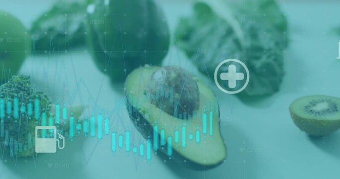 Animating turquoise waveform over halved avocado with pit on studio counter, icons moving near kiwi