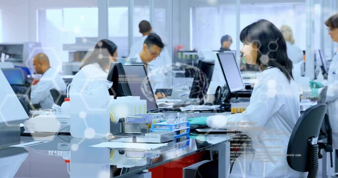 Typing seated female technician wearing lab coat, gloves at lab bench, with analyzer, copy space