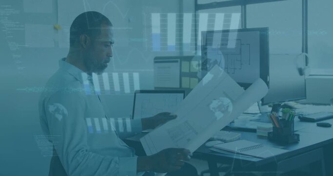 Architect verifying plans while monitor displaying floorplan causing overlays aligning with prints