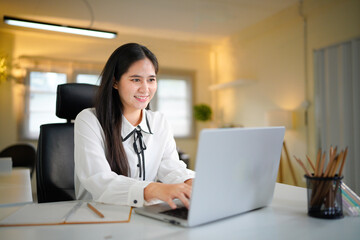 business woman using laptop application for work at table workspace in office. Smiling asian adult professional businesswoman using pc digital computer. Banner