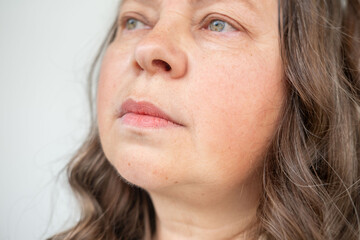 Naklejka premium annoyed mature woman with frustrated expression, Negative emotions, upset middle-aged female looking angry and irritated, Frustration and outrage, displeased lady disapproval, negative emotion,