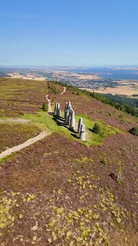 Drone Footage of Fyrish Monument Landmark, Scottish Highland Scenery, Purple Moorland, and Historic Stone Structures.