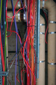 An electrical conduit system and a metal pipeline are installed on the building ceiling