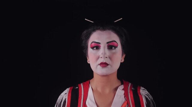 Young actress in traditional Japanese costume performing Madama Butterfly.
