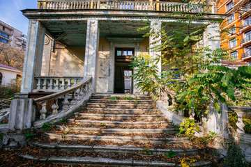 Fototapeta premium Old abandoned mansion in ruins and overgrowth