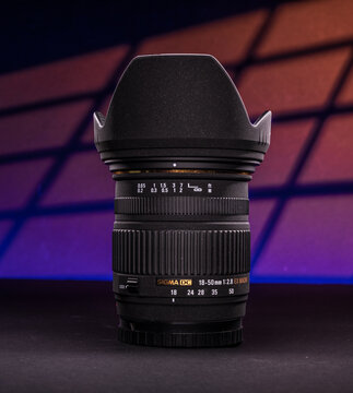 Gothenburg, Sweden - October 27 2024: Sigma DC 18 50mm f2.8 zoom lens standing in colorful studio light.