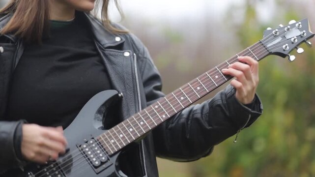 Close-up of playing an electric guitar