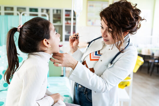 The doctor listens to the child&rsquo;s lungs with a stethoscope, then gently prepares them for a vaccine. The scene feels calm and caring, focused on the child&rsquo;s comfort and health.	

