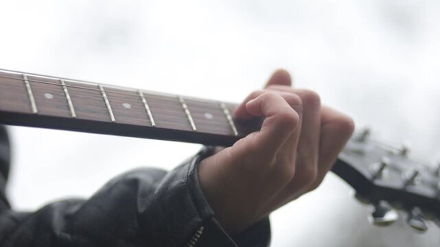 Close-up of playing an electric guitar