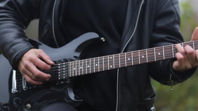 Close-up of playing an electric guitar