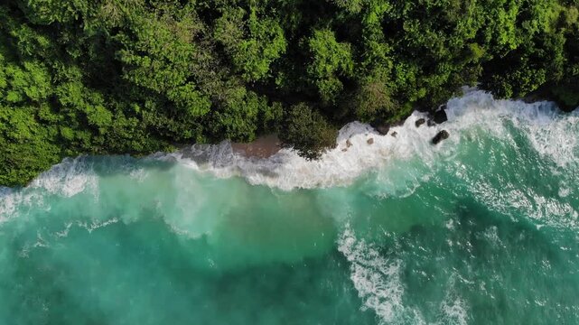 Top down aerial drone shot of Green Bowl Beach at high tide &ndash; Bali, Indonesia