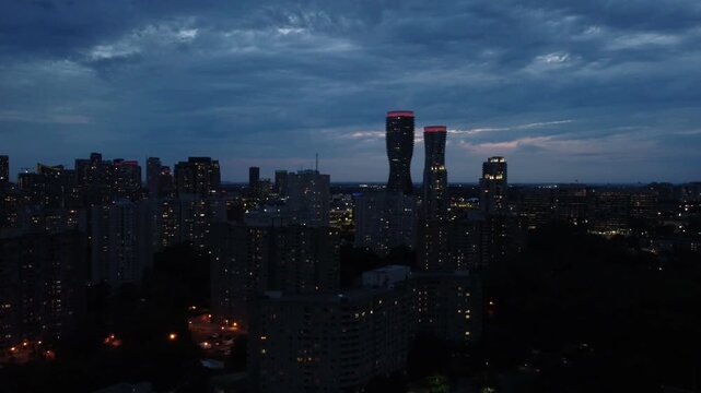 Aerial shot of the downtown city of Mississauga, Ontario, Canada skyline during night evening dusk, dark.