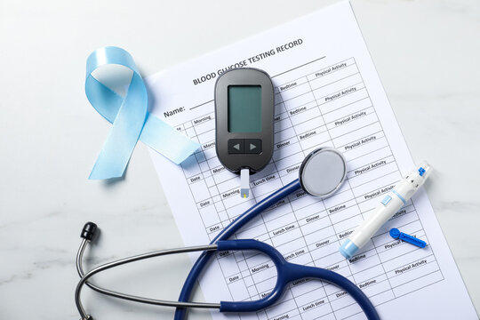 Diabetes. Flat lay composition with digital glucometer on light table