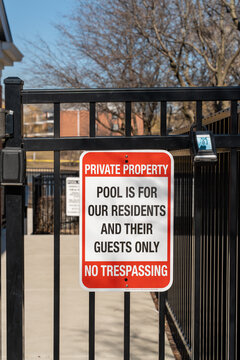 Private property sign in the USA reading &ldquo;Pool is for residents only &ndash; No trespassing,&rdquo; warning and safety concept, residential area