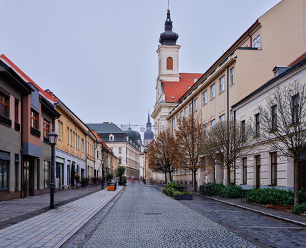 Historic Trnava Slovakia Street With Cobblestones And Classic Church Tower