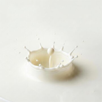 High speed macro photography of white milk drop creating a perfect crown splash on liquid surface with soft studio lighting and minimal aesthetic