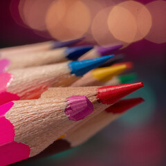 Fototapeta premium A vibrant, close-up macro shot of sharpened colored pencils with dramatic bokeh light ai illustration 