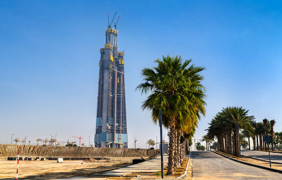 Jeddah, Saudi Arabia - February 11, 2026: Construction progress of the Jeddah Tower, set to be the tallest building in the world, viewed from a palm-lined road in the Abhur district.