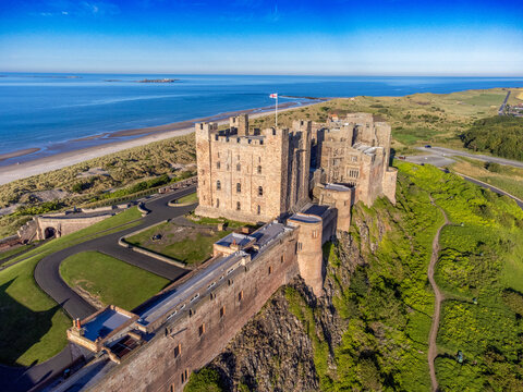 Bamburgh Castle, a striking medieval fortress located on the coast of Northumberland, England. 
