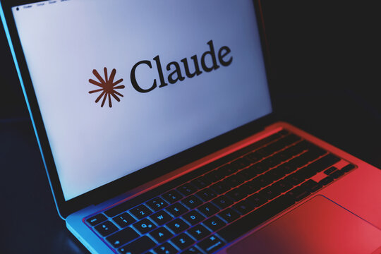 Laptop Displaying Claude AI Logo on White Background
