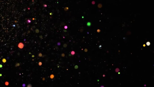 colorful confetti dots on black background