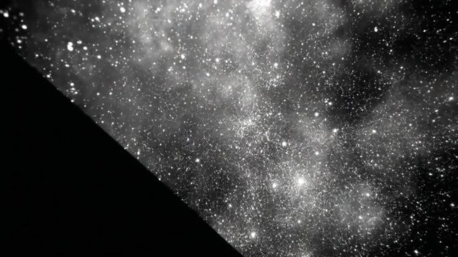 Black diagonal line against a backdrop of a starry night in a monochrome format