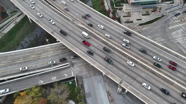 Overhead view of highway and traffic lanes driving in downtown Houston, Texas 4K Aerial Drone Video