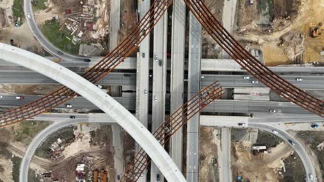 Overhead view of texas highway interchange and road construction 4K Aerial Drone Video