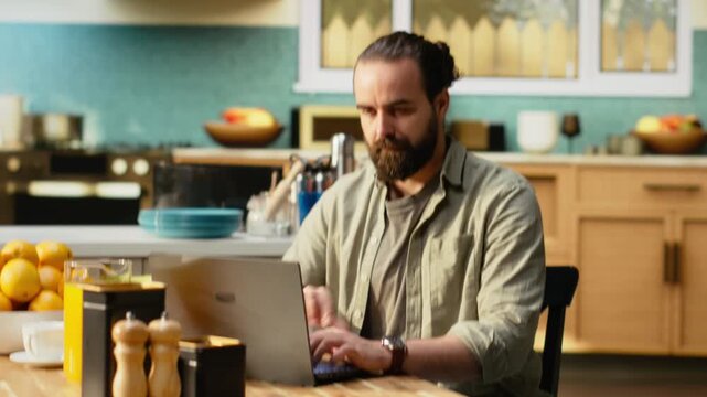 Professional man checking time on wristwatch and running late to the office, preparing to leave the house in a hurry to avoid delay. Person looking at the late hour during breakfast in kitchen.