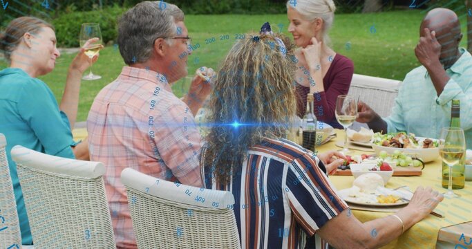 Chatting six adults sharing meal on grassy lawn, with yellow cloth wine bottles, cheese blue glare