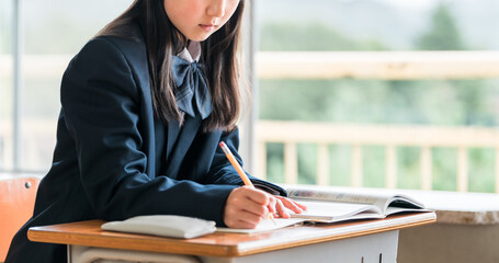 Junior high school students studying seriously in school classrooms and cram school classes