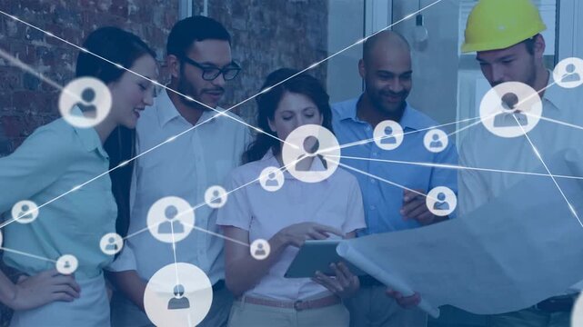 Lead woman tapping tablet initiating animated network growing while team reviewing plans for design