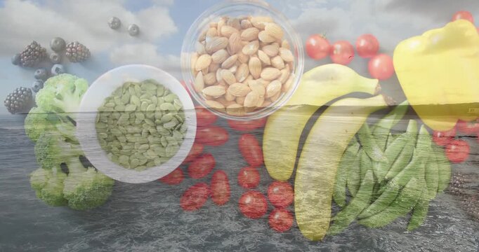 Blending centered flat-lay of produce shifting over ocean, with bananas bell pepper seed bowl