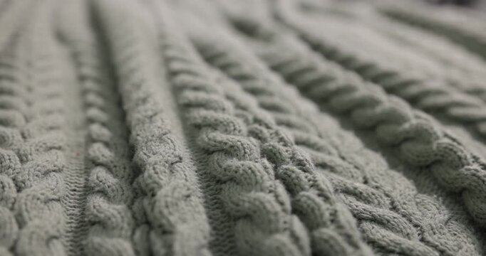 Soft knitted plaid as background, closeup view