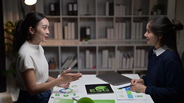 Asian businesswomen shaking hands on an esg deal
