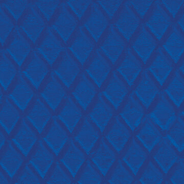 Deep blue embossed diamond pattern with textured finish. Seamless bold geometric background perfect for wallpaper, luxury packaging and graphic design.