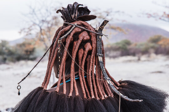 Close-up detail of adorned tradition: a Himba woman's beaded hair from behind, Southern Angola