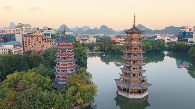Sunrise aerial view of Sun and Moon Twin Pagodas at Shanhu Lake, Guilin, China