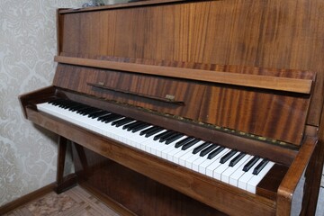 Fototapeta premium Vintage upright piano isolated on white background, front view