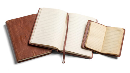 four vintage leather-bound notebooks, including open journals and a small diary, isolated on a...