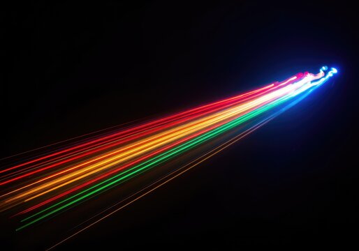 Streaks of vibrant, glowing residual light captured in a slow-shutter abstract composition, creating smooth, dynamic trails of color and energy, blur, digital, design